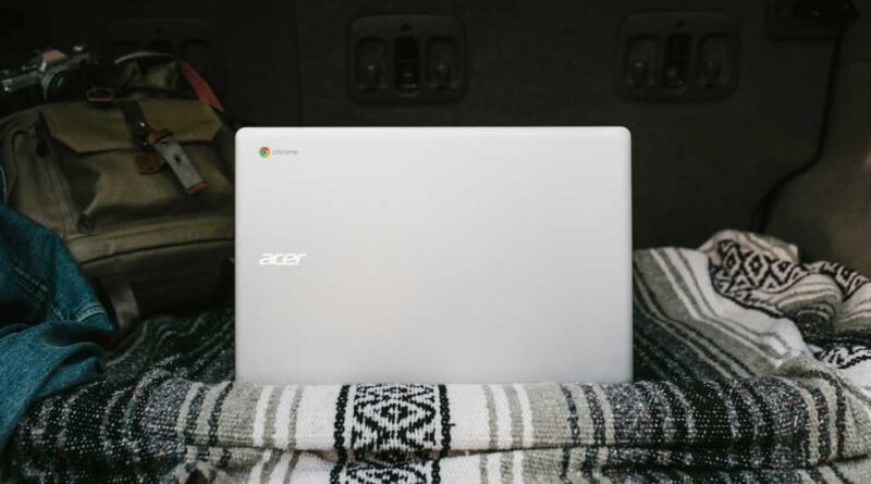 Acer Chromebook on a blanket in bed