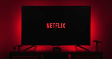 Netflix logo on smart TV with moody red backlighting