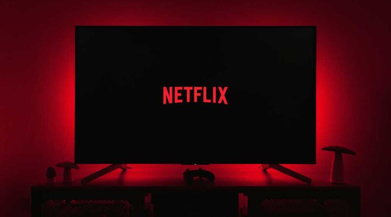 Netflix logo on smart TV with moody red backlighting