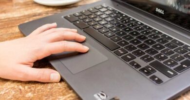 Hand on laptop touchpad