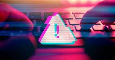 Digital warning alert while man types on a keyboard