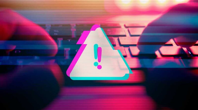 Digital warning alert while man types on a keyboard