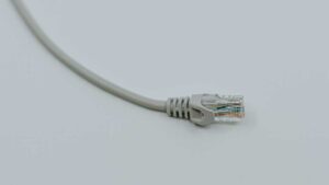 Ethernet network cable on its own on white surface