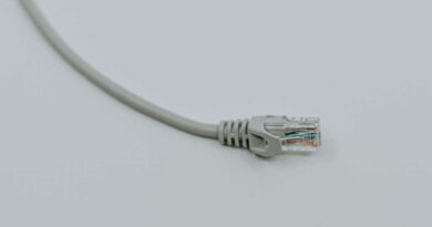 Ethernet network cable on its own on white surface