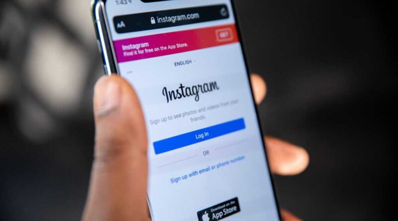 A mobile phone showing the instagram login page