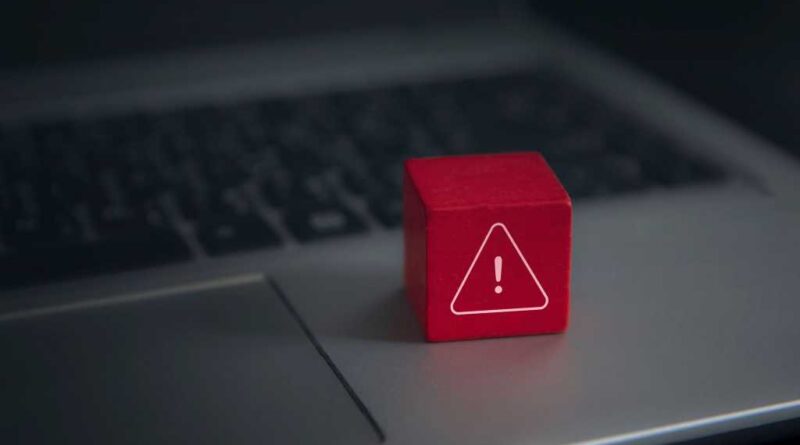 Computer error visualized as a Toy Block placed upon a Laptop keyboard