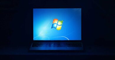 Windows 7 on laptop screen in dark room