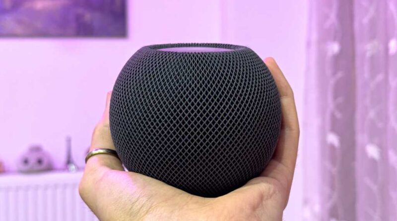 Apple Homepod mini held in hand