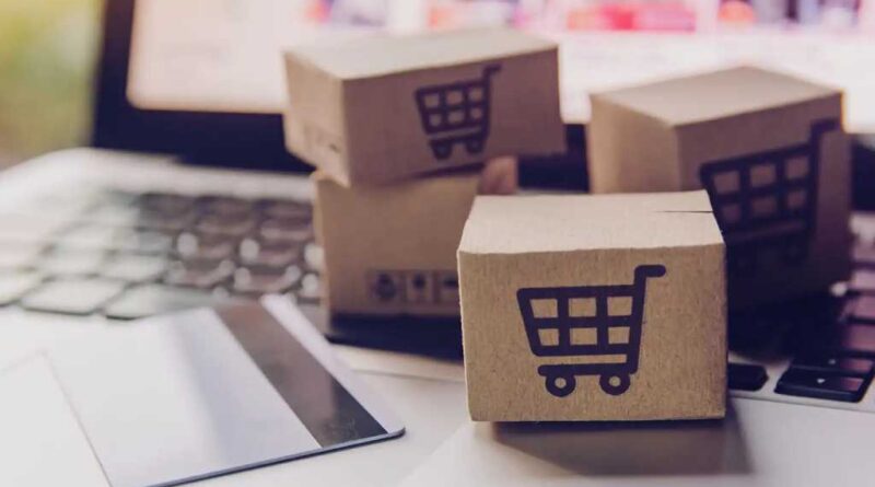 Amazon Shopping card boxes and credit cards on laptop keyboard