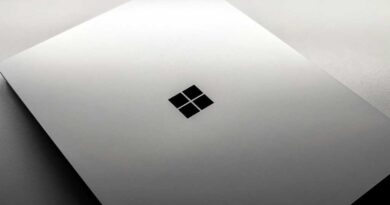 Windows laptop with lid closed on ominous white background surface hero