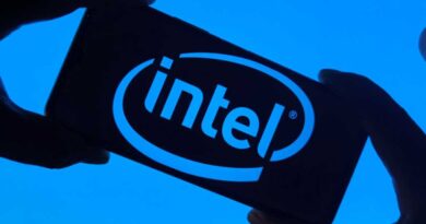 Intel logo on smartphone silhouette held in fingers