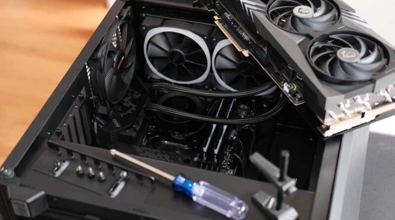 PC building - open computer case with parts still to be installed