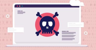 Computer virus - Laptop with red screen and skull showing danger and malware alert.