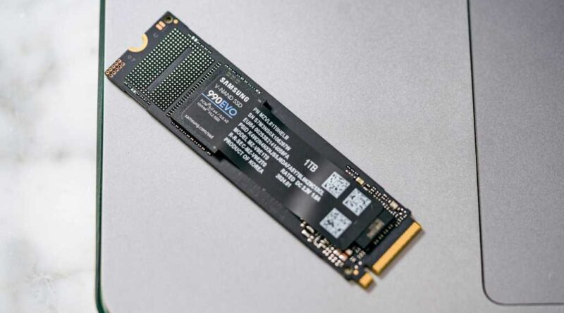 Samsung 990 EVO SSD sitting on a laptop