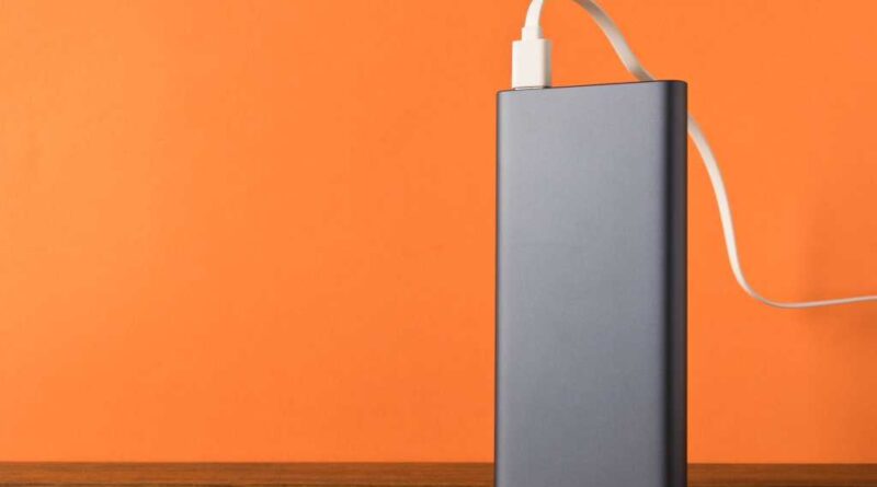 Power bank on desk plugged in and being charged