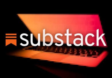 Substack logo on a blurred background of a laptop halfway closed