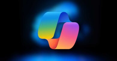 Microsoft Copilot logo on blurred Windows 11 laptop background