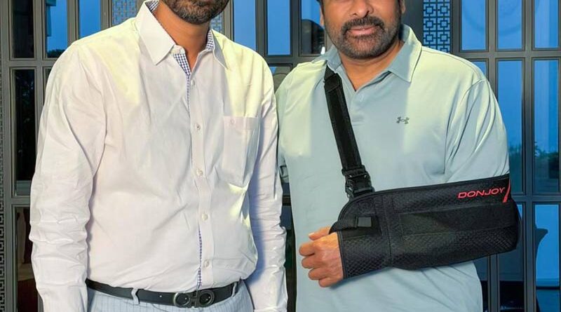 Why is Mega Star wearing a hand belt