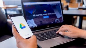 Google Drive on phone and laptop with user using it