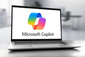 Microsoft Copilot logo on open laptop screen