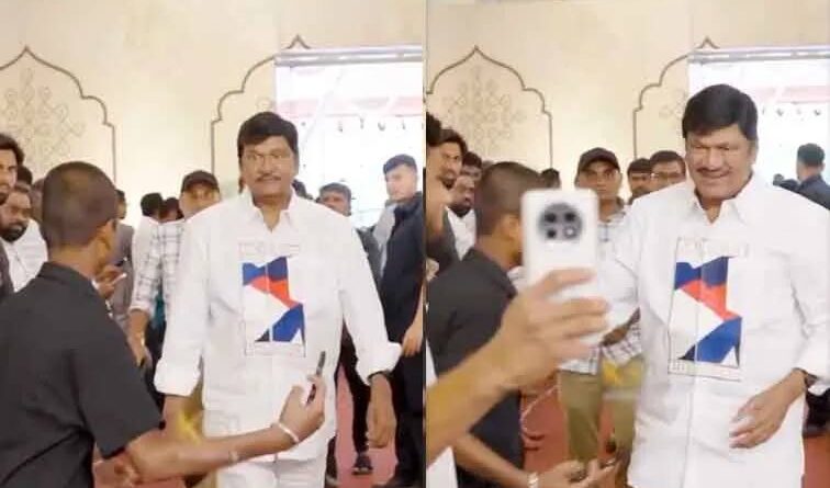 Rajendra Prasad pushes away a fan