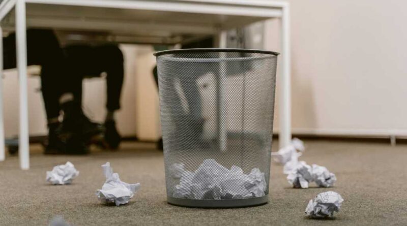Paper in a wastebasket (and outside on the ground too)