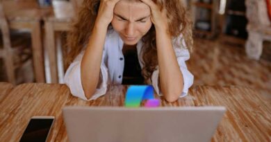 oh god why copilot why woman frustrated with laptop