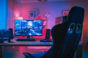 Gaming PC rig with RGB workstation and empty gaming chair