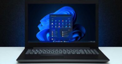 Windows 11 laptop with Start menu showing front hero