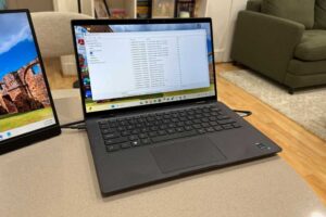 Windows 11 PC with system information window