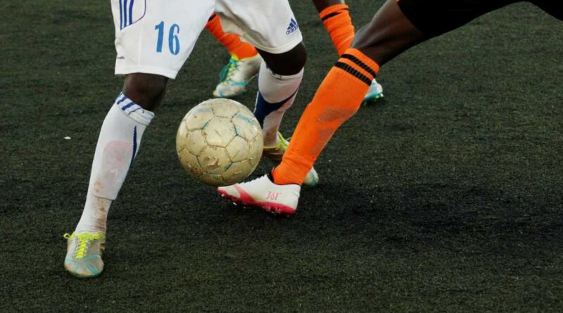 two players with a soccer ball