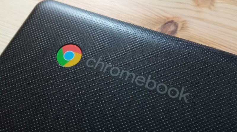Chromebook logo closeup on black laptop lid hero