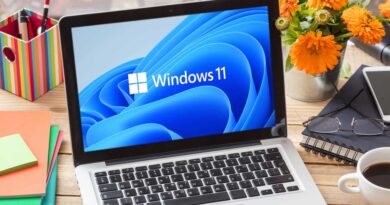 Windows 11 official brand sign on computer laptop display, business office table