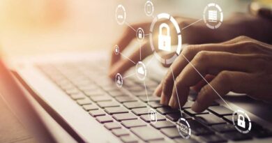 Man on laptop with protective security locking symbols