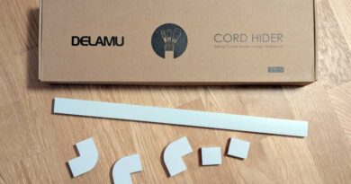 Delamu Cord Hider box with a few pieces scattered outside the box