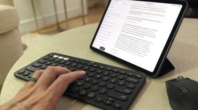 Claude Code on a table with a keyboard