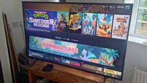 DIY Steam Machine running on a large TV on a wooden stand