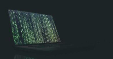 Fake code glitch on a laptop in a dark room
