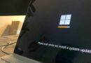 Windows 11 system update message on a laptop screen