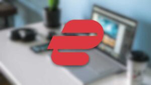 ExpressVPN logo on a blurry laptop desk background