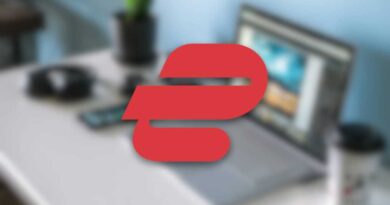 ExpressVPN logo on a blurry laptop desk background