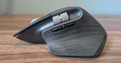 Side view of a Logitech MX Master 3S with two buttons and a scroll wheel.