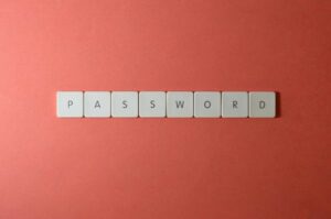 The word "password" spelled out in tiles on a pink background