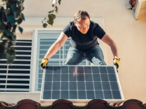 Man installing solar panel