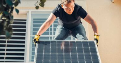 Man installing solar panel