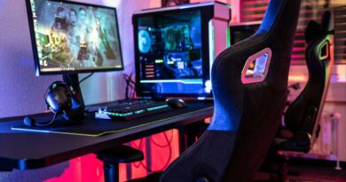 Gaming chair at a desk with gaming desktop PC rig and lots of RGB colors