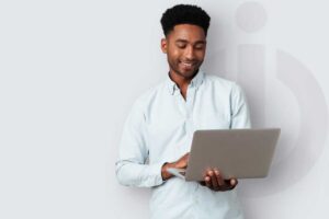 iolo guy holding laptop with grey iolo