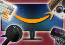 Keyboard, microphone, speaker, and mouse, arranged around a monitor with an Amazon logo